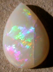 Fire Opal white Gemstone - nature, use, combinatons